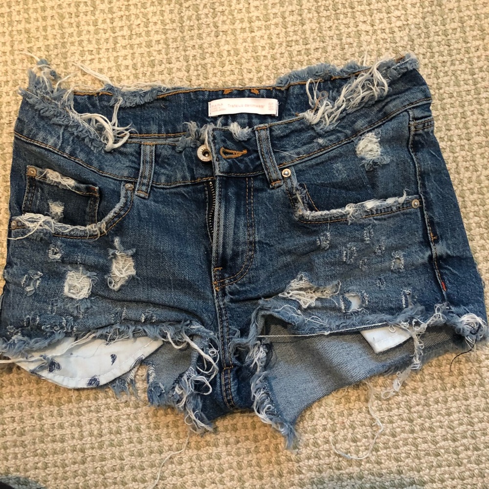 Blue distressed denim booty shorts